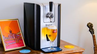The PerfectDraft Beer machine with a poured pint of beer on the drip tray