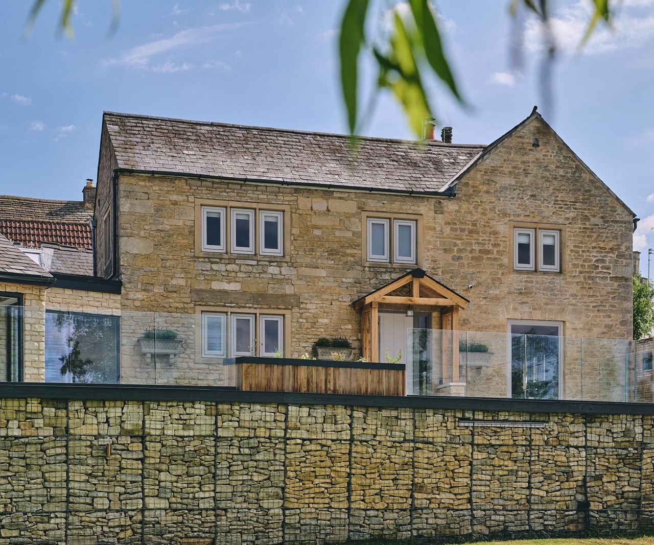 View of a refurbished 18th century stone house with an extension