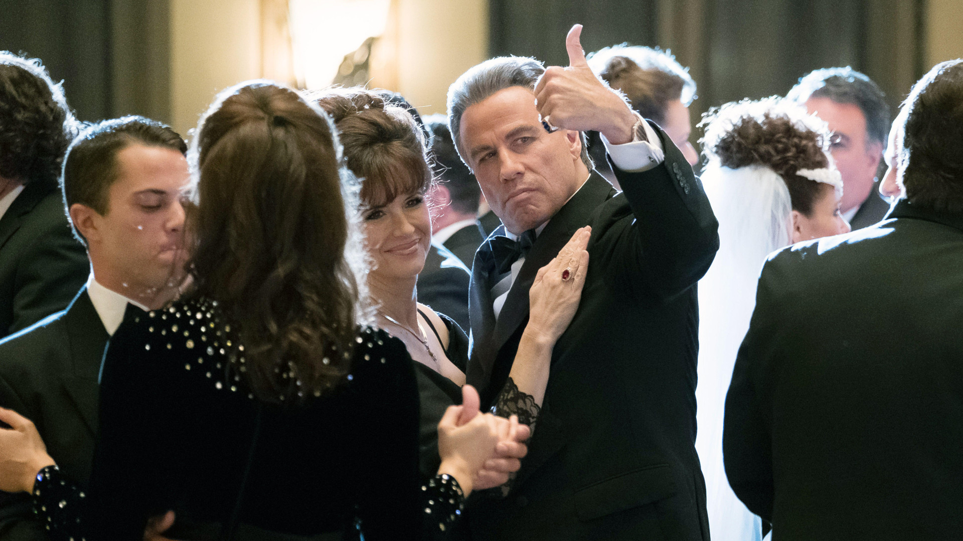 John Travolta as John Gotti giving a thumbs up in Gotti