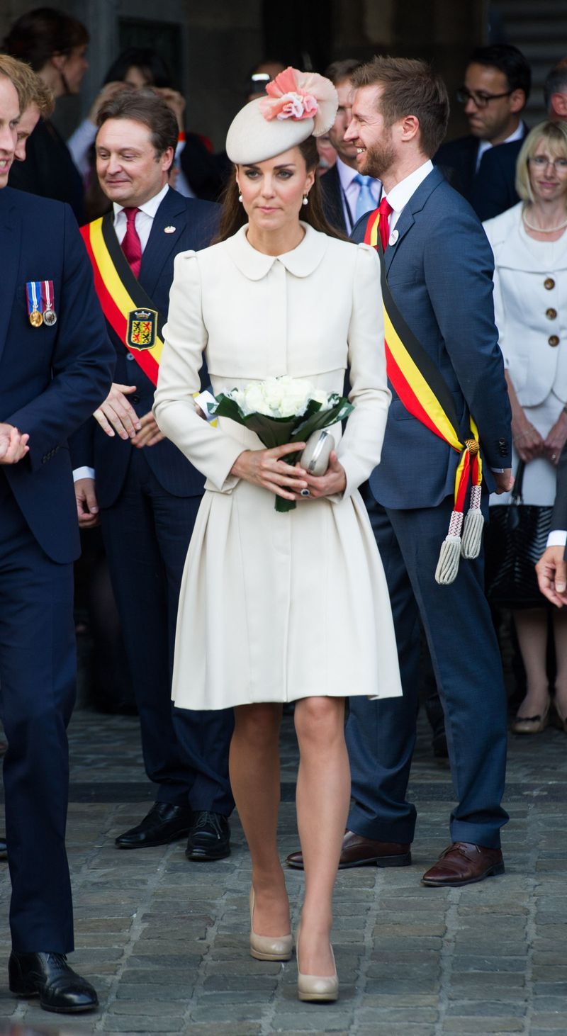 Commemorating World War I in Belgium, she looked lovely in a blush-toned Alexander McQueen coat dress.