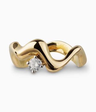 Golden band with wave shapes and a diamond on top.