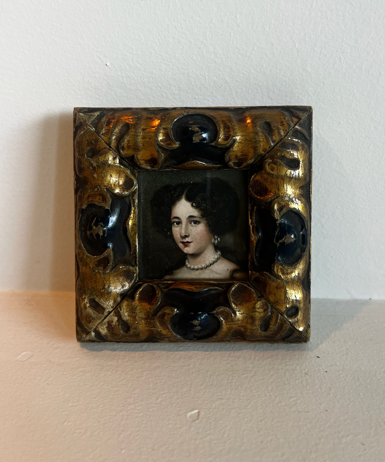 small piece of vintage art with a gold frame