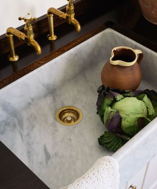 Design a kitchen sink with marble sink