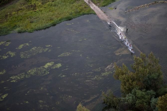 Riders cross the Breede River during stage 2
