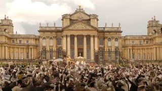 a giant crowd outside the palace on queen charlotte: a bridgerton story