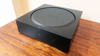 Sonos Amp on a wooden surface