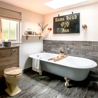 bathroom with bathtub and wooden drawer
