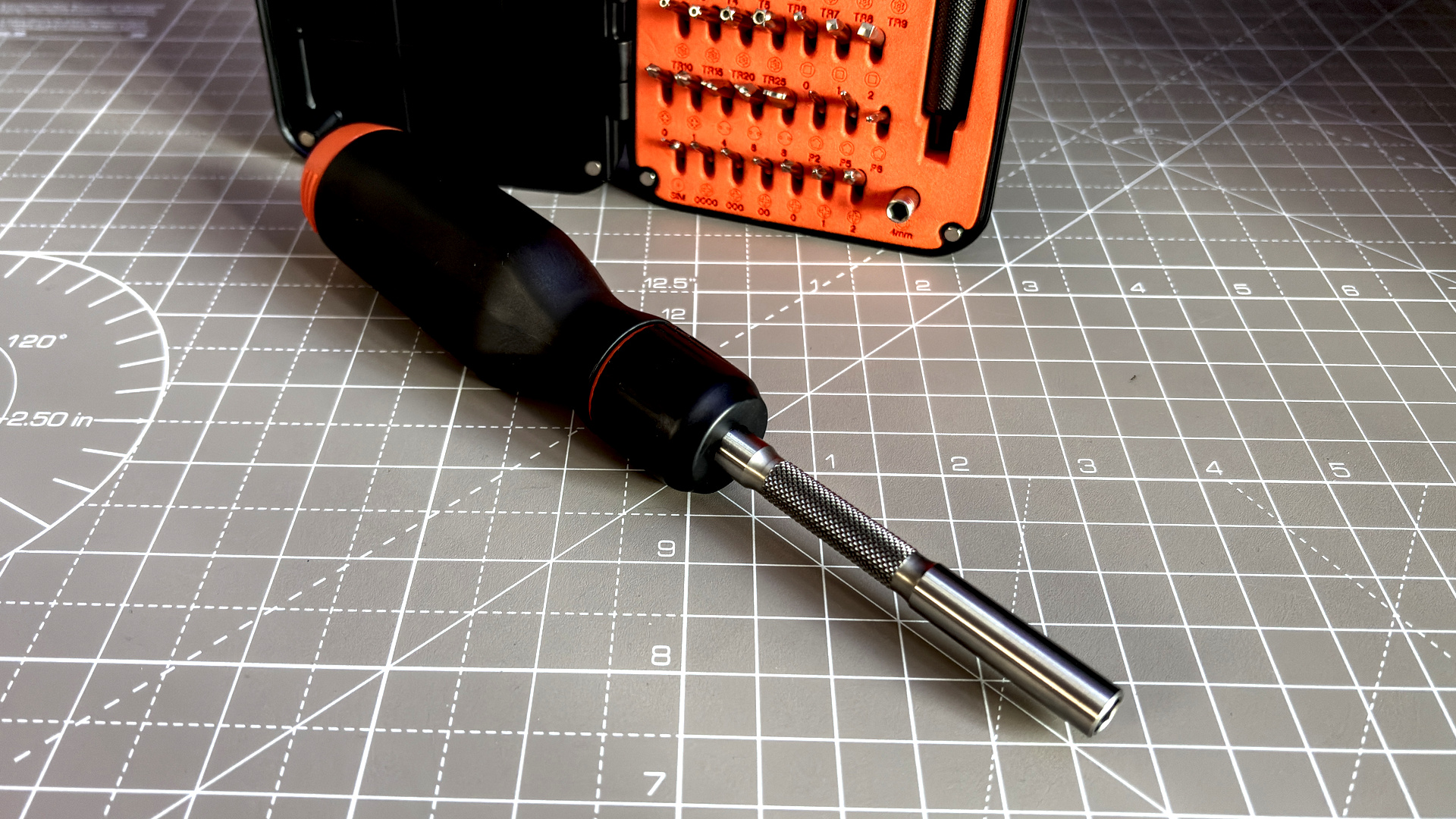 Two screwdrivers on a desk with orange highlights, sold by the YouTube channel Linus Tech Tips, or LTT for short.