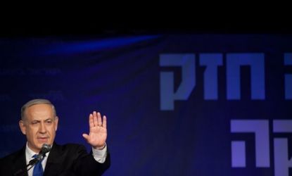 Israeli Prime Minister Netanyahu waves to his supporters at his election campaign headquarters on Jan. 23.