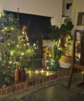 red tiled closed fireplace with christmas decorations on the hearth