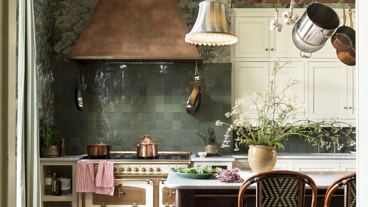 House of Hackney&#039;s kitchen with green tiles and marble work space 