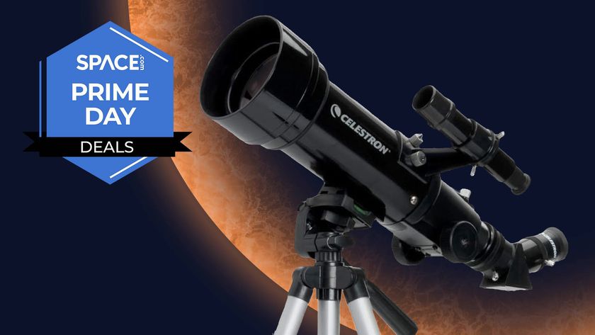 A Celestron Travel Scope 70 against an orange planet background, with a Space Prime Day deals logo. 