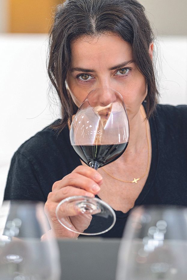 Woman tasting wine