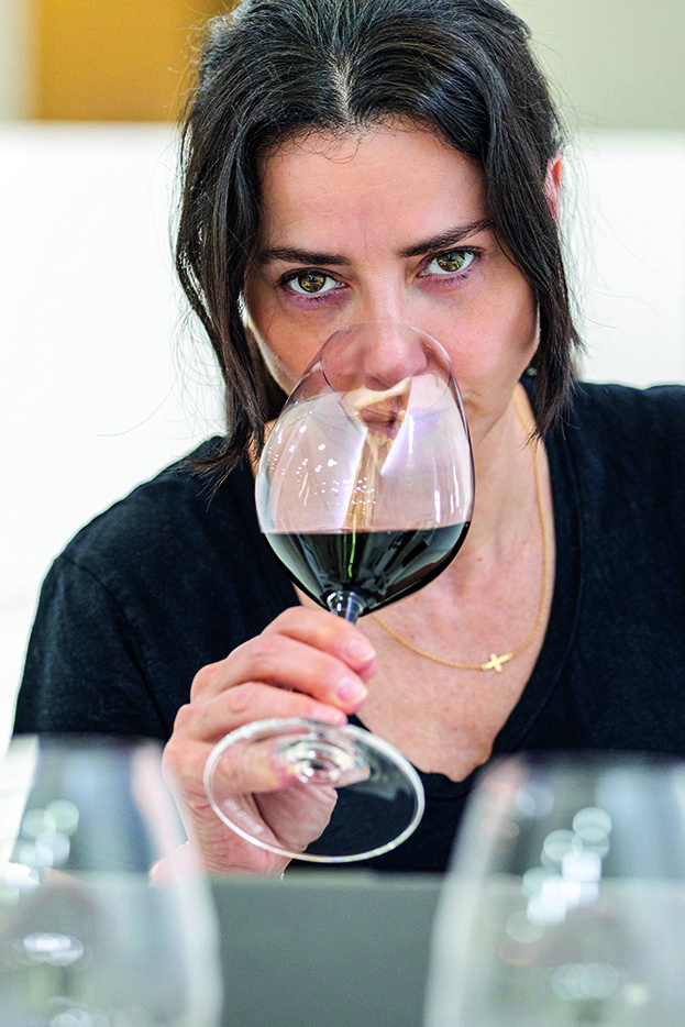 Woman tasting wine