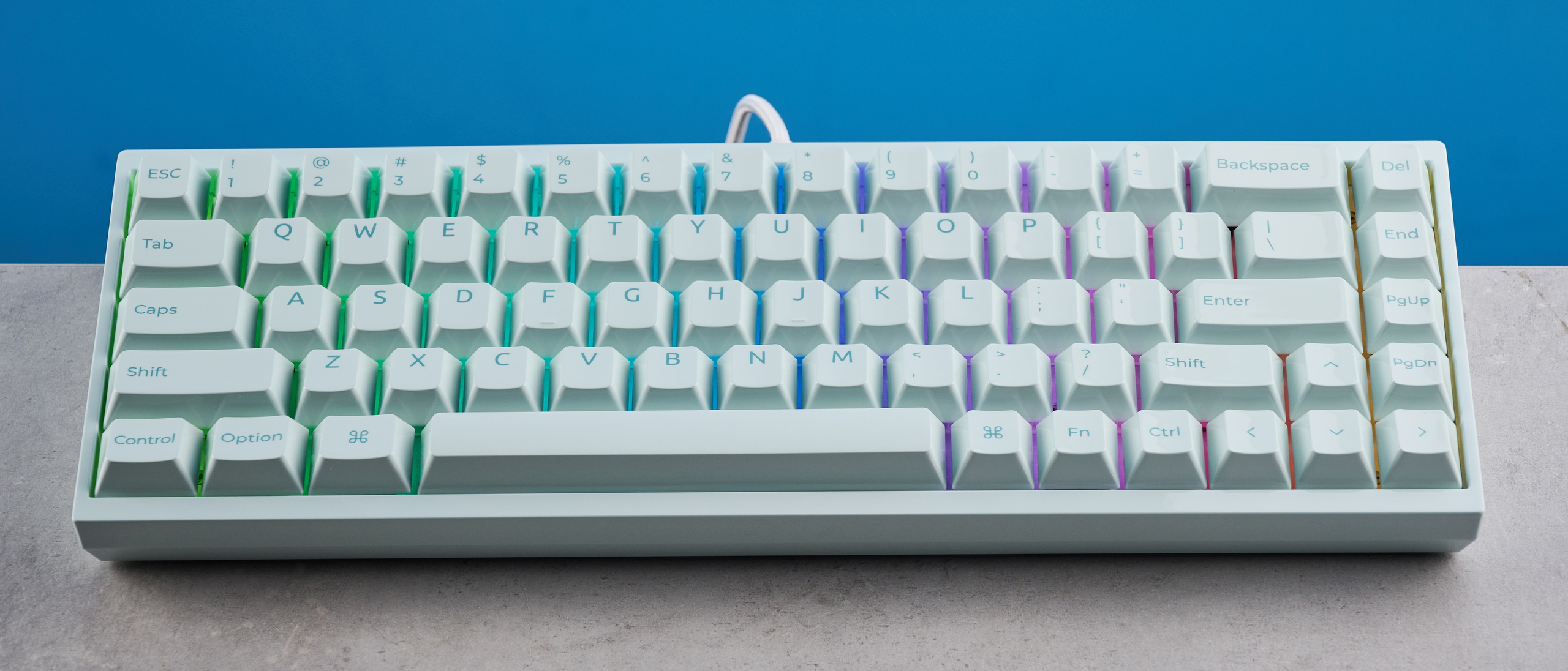 The Keychron Q16 HE 8K in light green on a stone surface