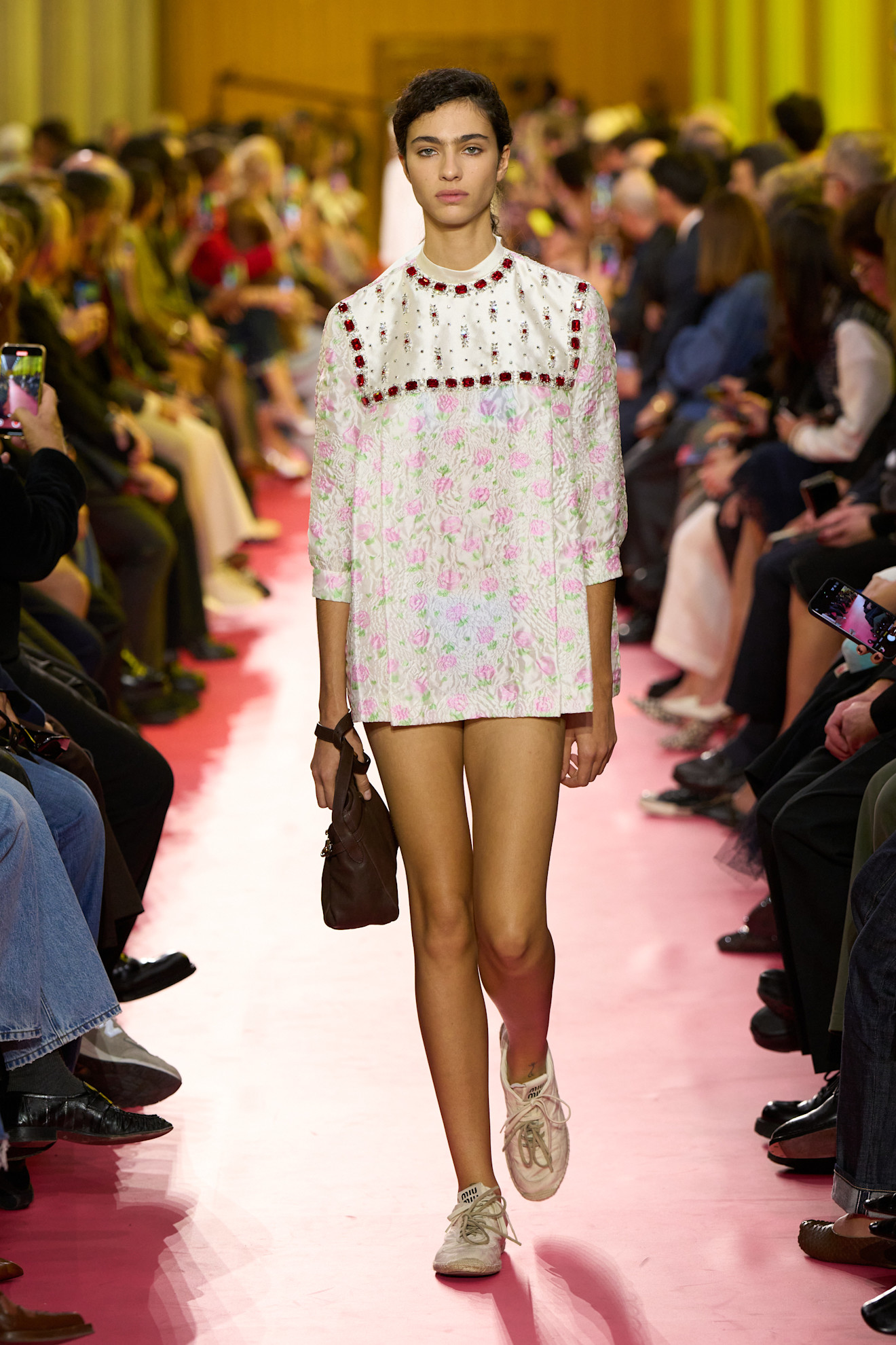 A model wore the babydoll dress trend on the Miu Miu Spring 2026 runway