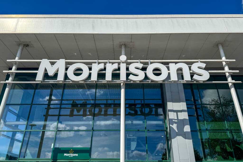 The Morrisons supermarket logo is displayed outside a branch of the supermarket retailer Morrisons in Wells
