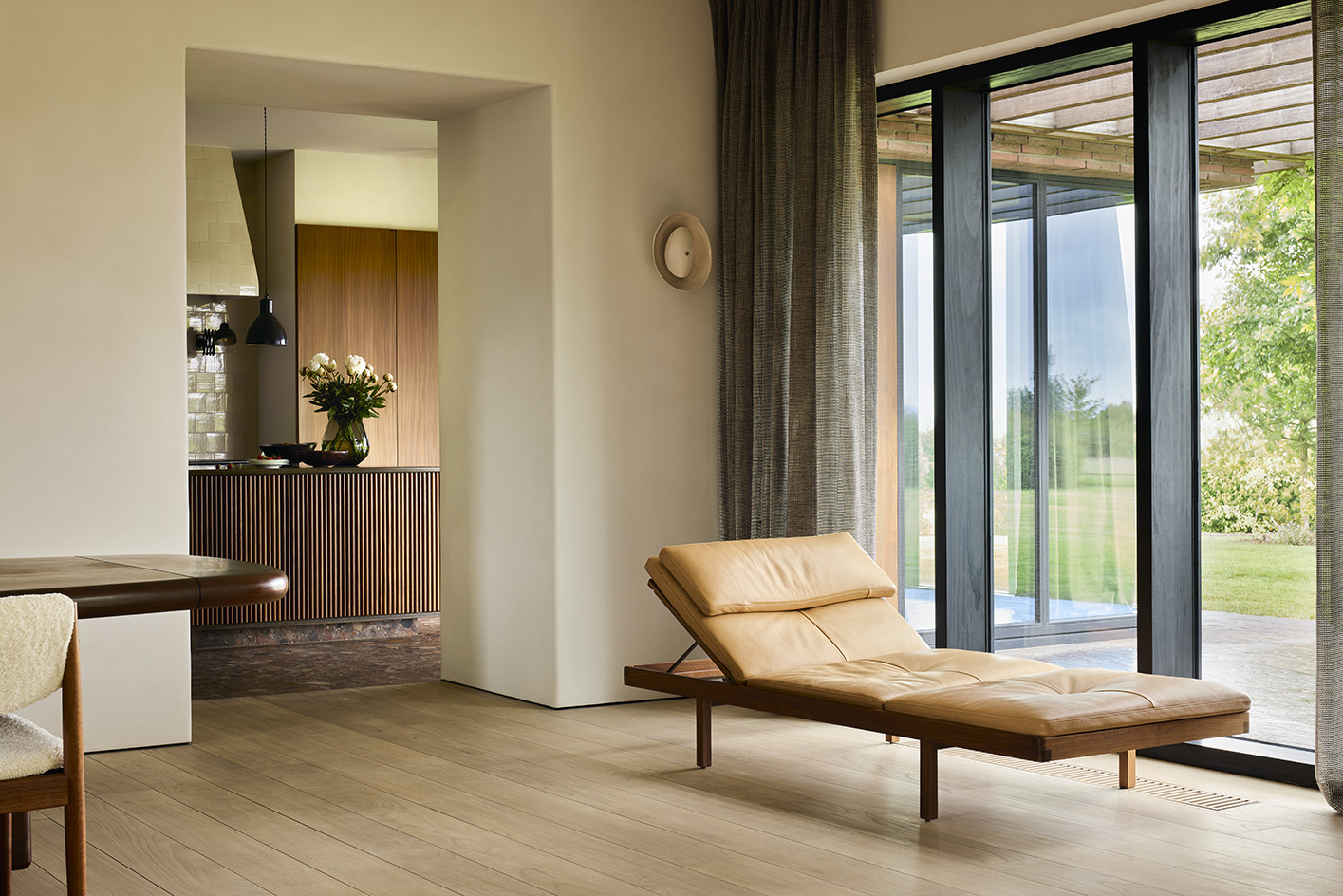 Flemish House by Julie Thiers, a brick house among greenery