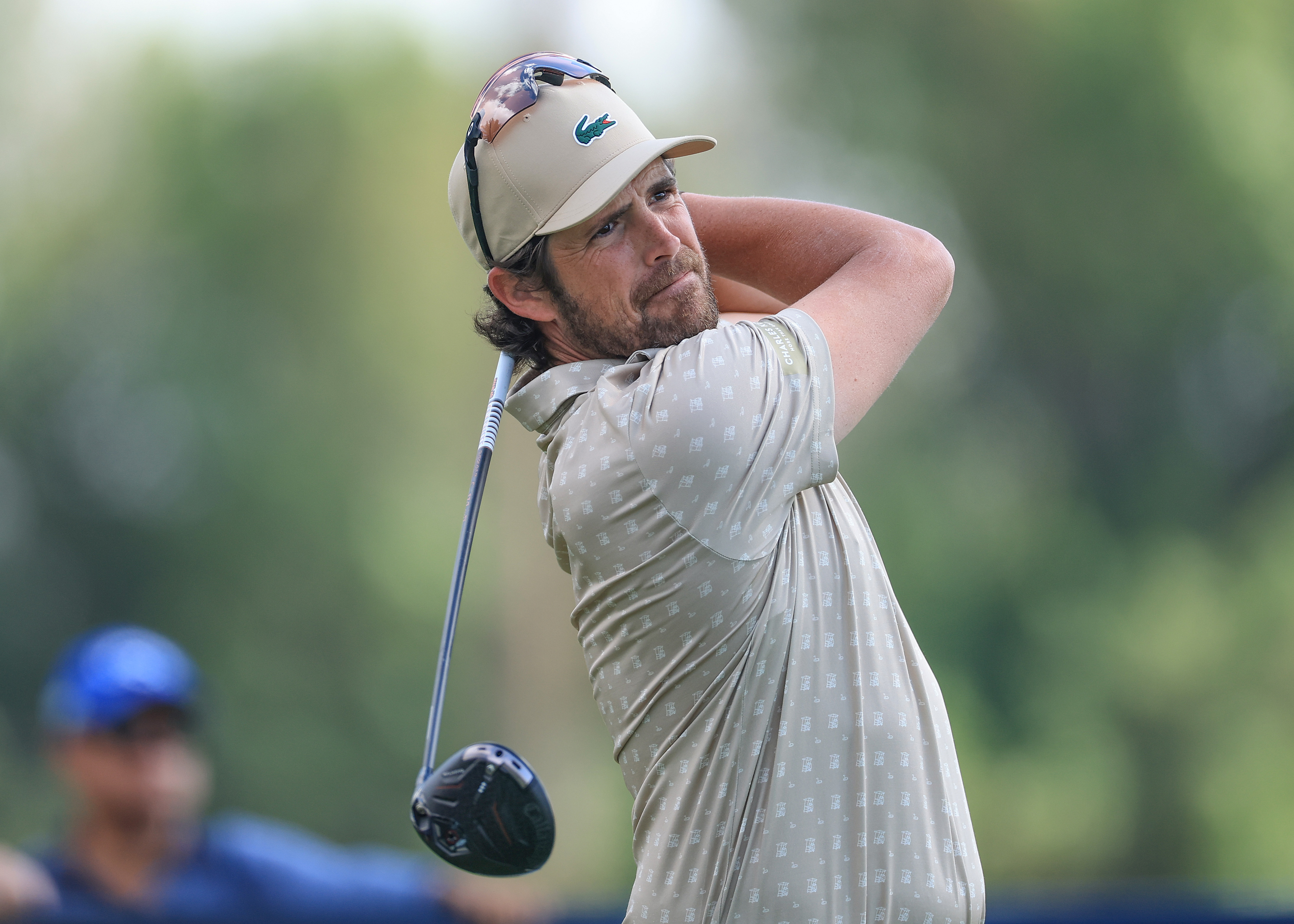 Nacho Elvira hits a tee shot and watches its flight