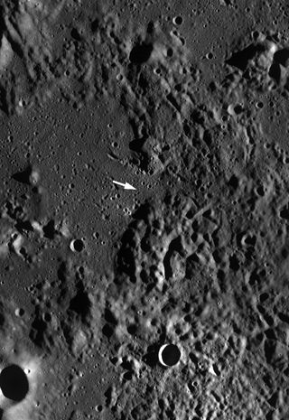 This Lunar Reconnaissance Orbiter Wide Angle Camera monochrome mosaic of the Cayley Plains (smooth areas) and Descartes Mountains surrounding the Apollo 16 landing site (arrow indicates approximate position of the lunar module). Image M116215423M, scene w