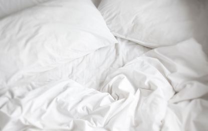 A close up of white bedding