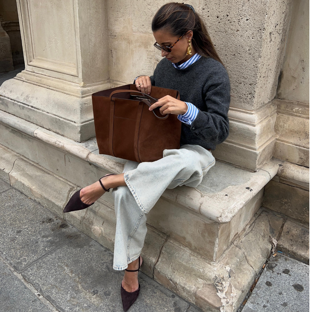 I just found the perfect French-girl approved suede bag- and it fits a laptop