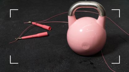 Large kettlebell and skipping rope on gym floor, representing gym mistakes beginners often make