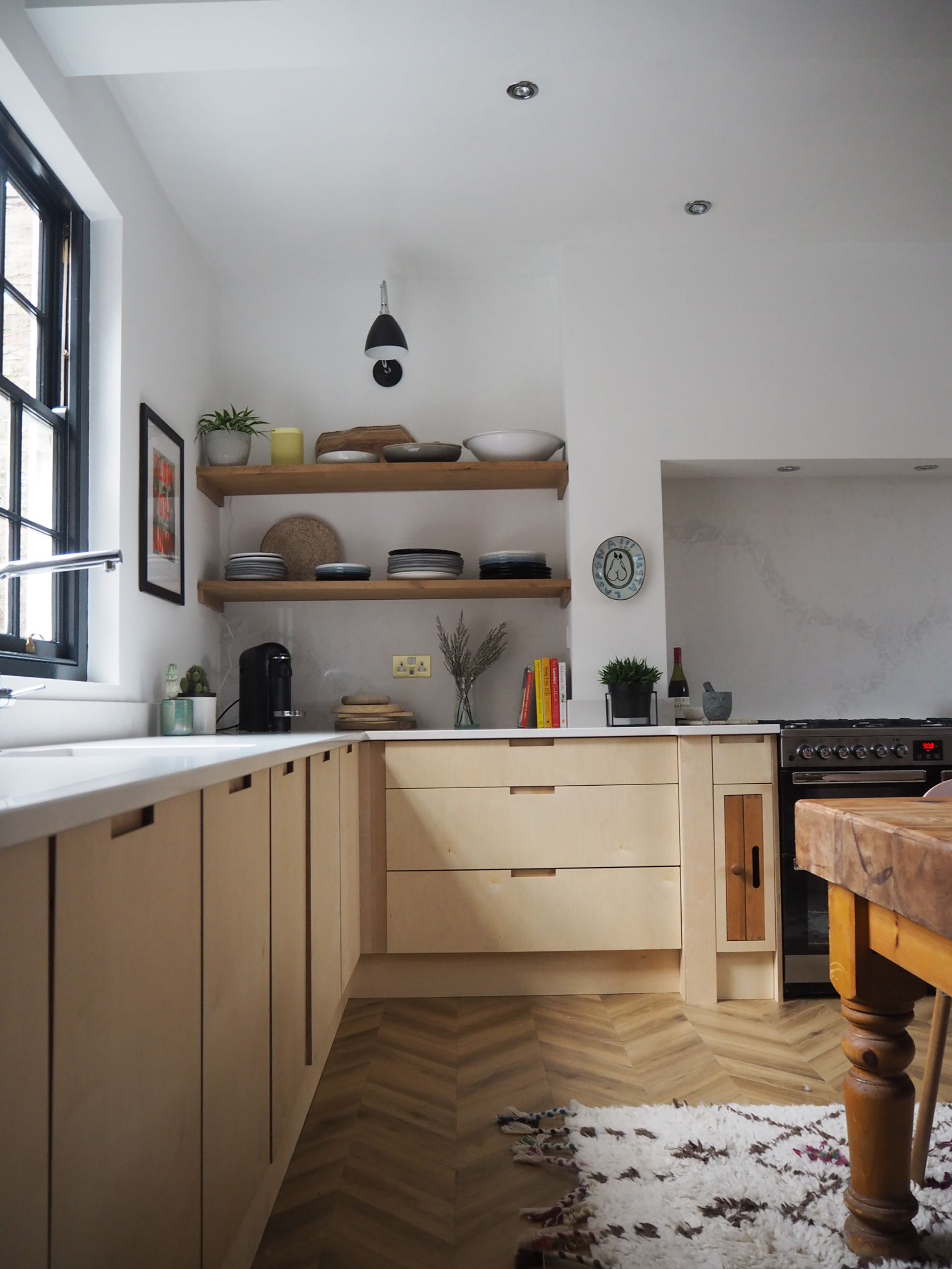 small kitchen with beige cabinetry and white caesarstone worktops