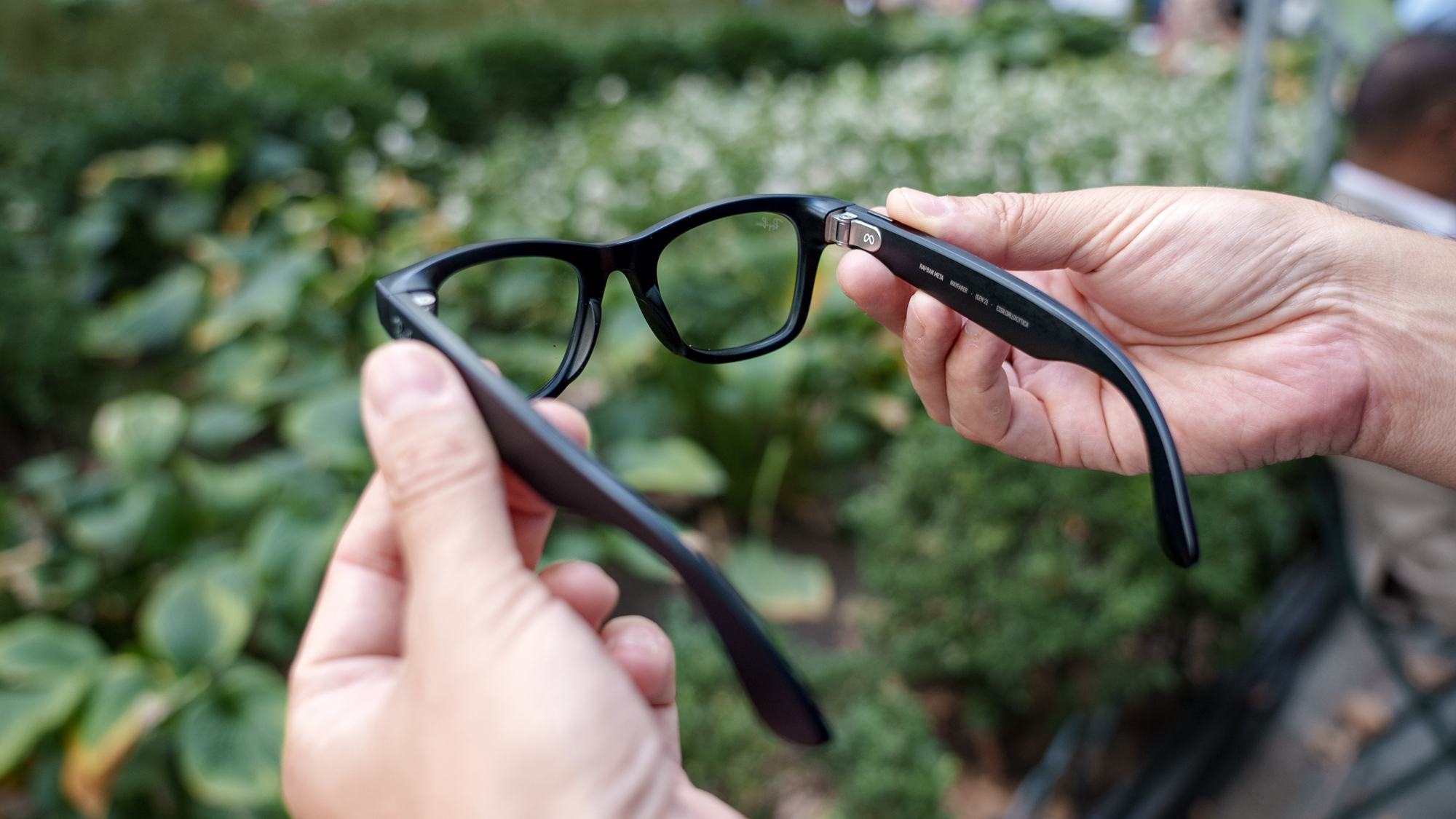 Holding the Meta Ray-Ban (gen 2) smart glasses