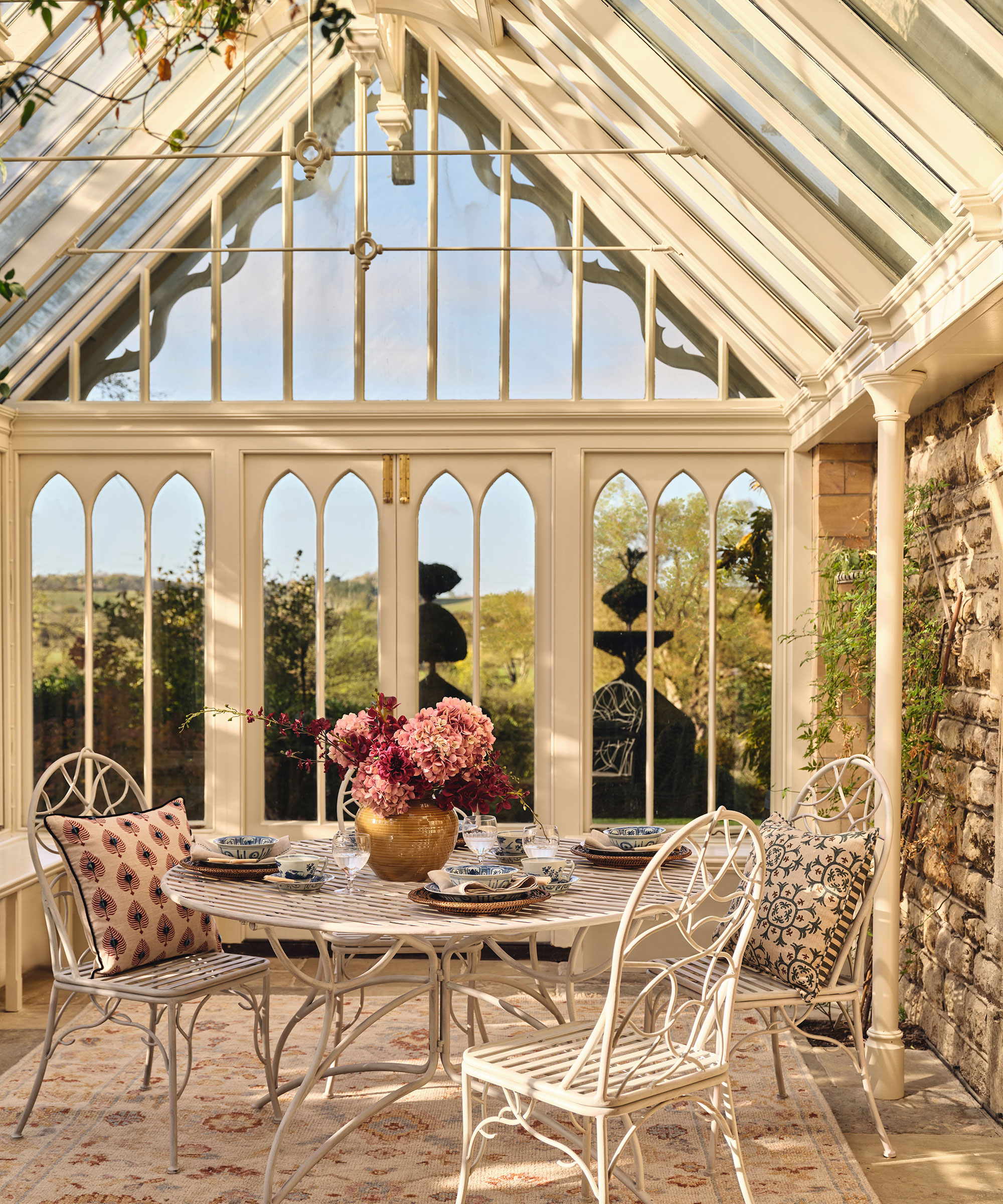 glazed pergola seating area leading from orangery