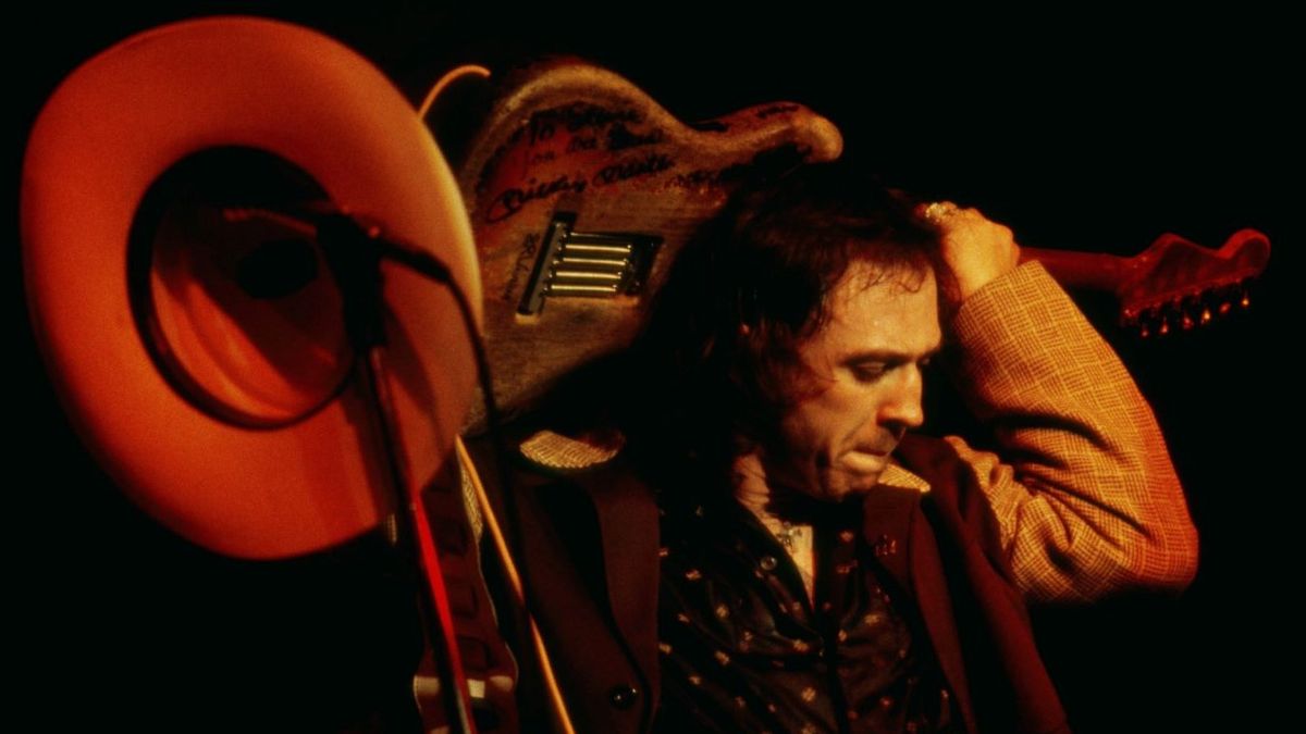 American musician, guitarist and singer Stevie Ray Vaughan (1954-1990) performs live on stage playing a Fender Stratocaster guitar (Number One) behind his head during a concert performance at the New Orleans Jazz &amp; Heritage Festival in New Orleans, Louisiana on 2 May 1985. 