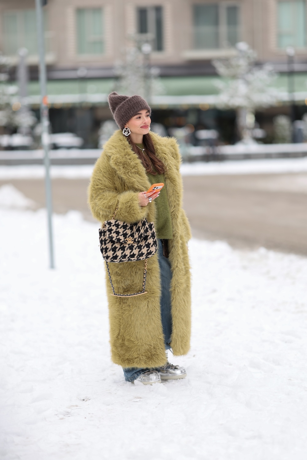 models at copenhagen fashion week wearing fur coats and colorful coats