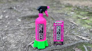 The Muc-Off Bottle for Life with its bright pink alloy bottle and green holder