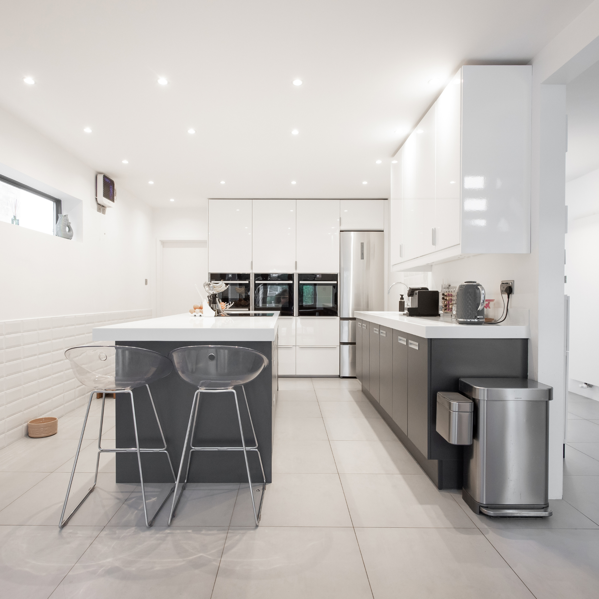 Modern kitchen with stainless steel appliances.