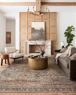 traditional patterned rug in a minimaluxe living room