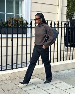 A London woman in a brown sweater.