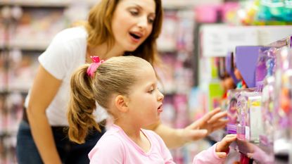 mother and daughter shopping for toys.