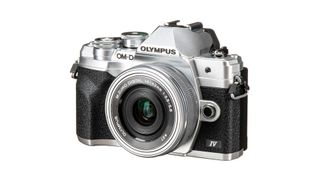 Olympus OM-D E-M10 Mark IV angled front view on white background