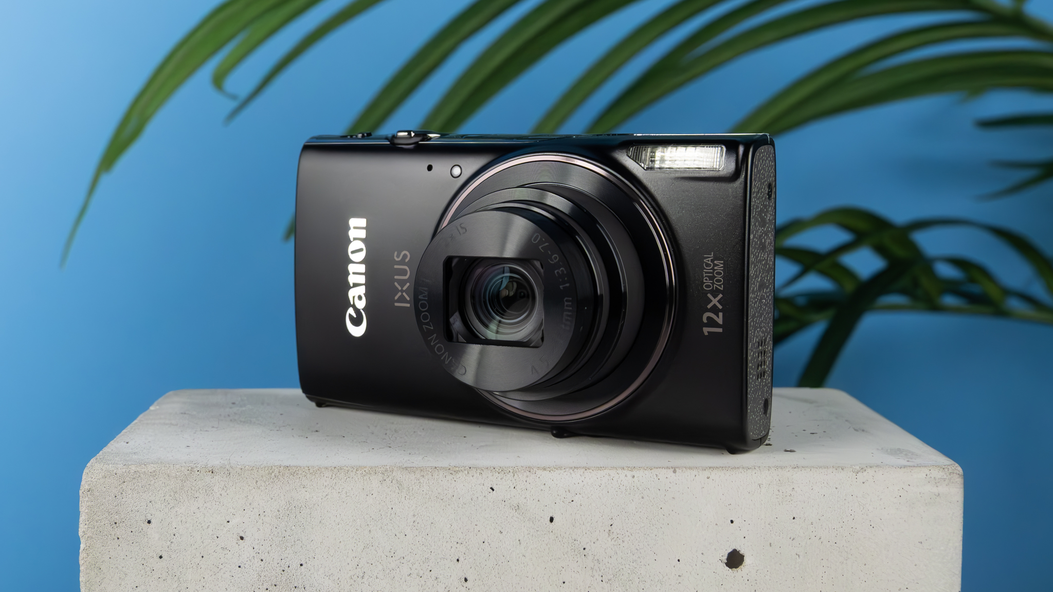 A black Canon PowerShot Elph 360 HS A or Canon PowerShot IXUS 285 HS A compact camera