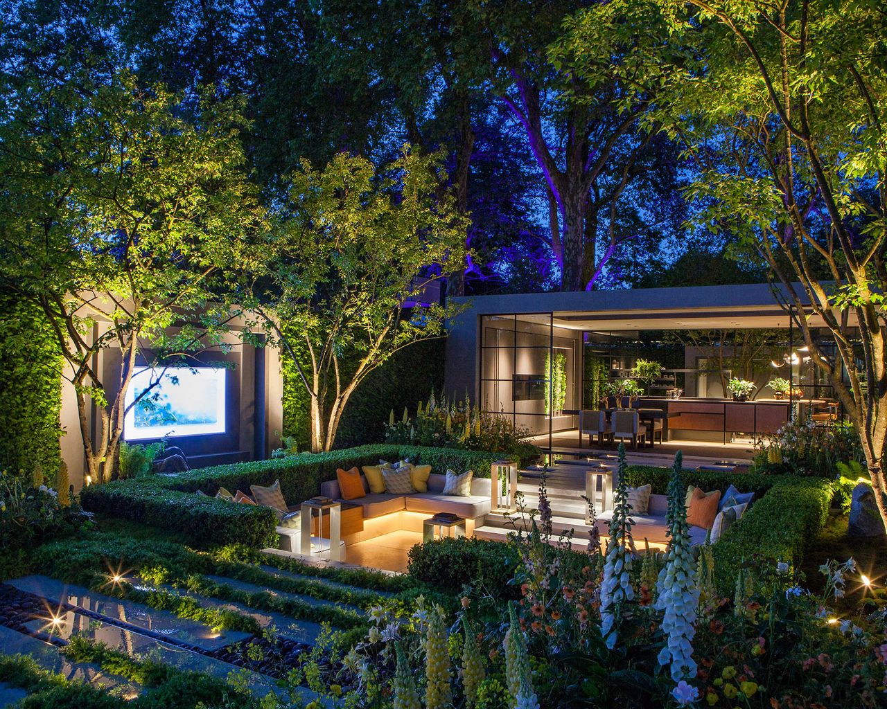 sunken garden with entertainment area and lighting