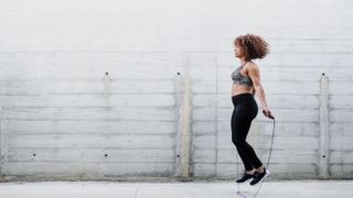 Woman doing one of the best cardio workouts: skipping rope