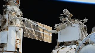 Cosmonauts Sergey Prokopyev and Dmitri Petelin work outside the space station during a spacewalk on April 19, 2023.