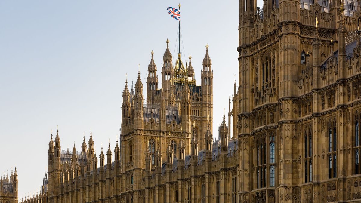 The UK house of parliament flying the Union flag