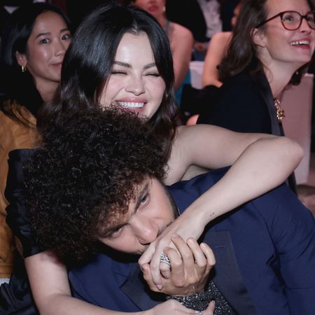 Selena Gomez laughing and Benny Blanco kissing her hand at the Second Annual Rare Impact Fund Benefit in October 2024