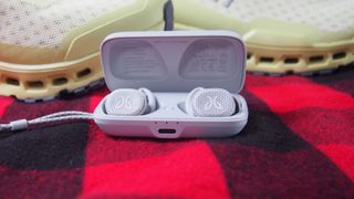 The jaybird vista 2 true wireless earbuds in white in their charging case