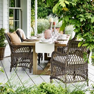 outdoor dining table area with dining table and chair and wooden floor