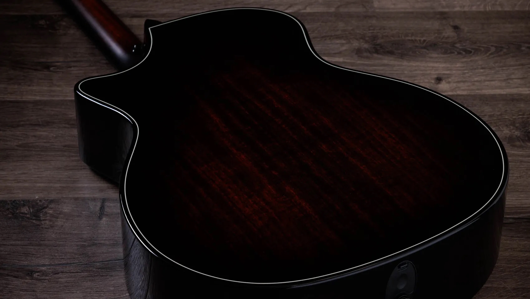A photo showing a detail of the Taylor Next Generation 514ce Builder&rsquo;s Edition in Kona Burst