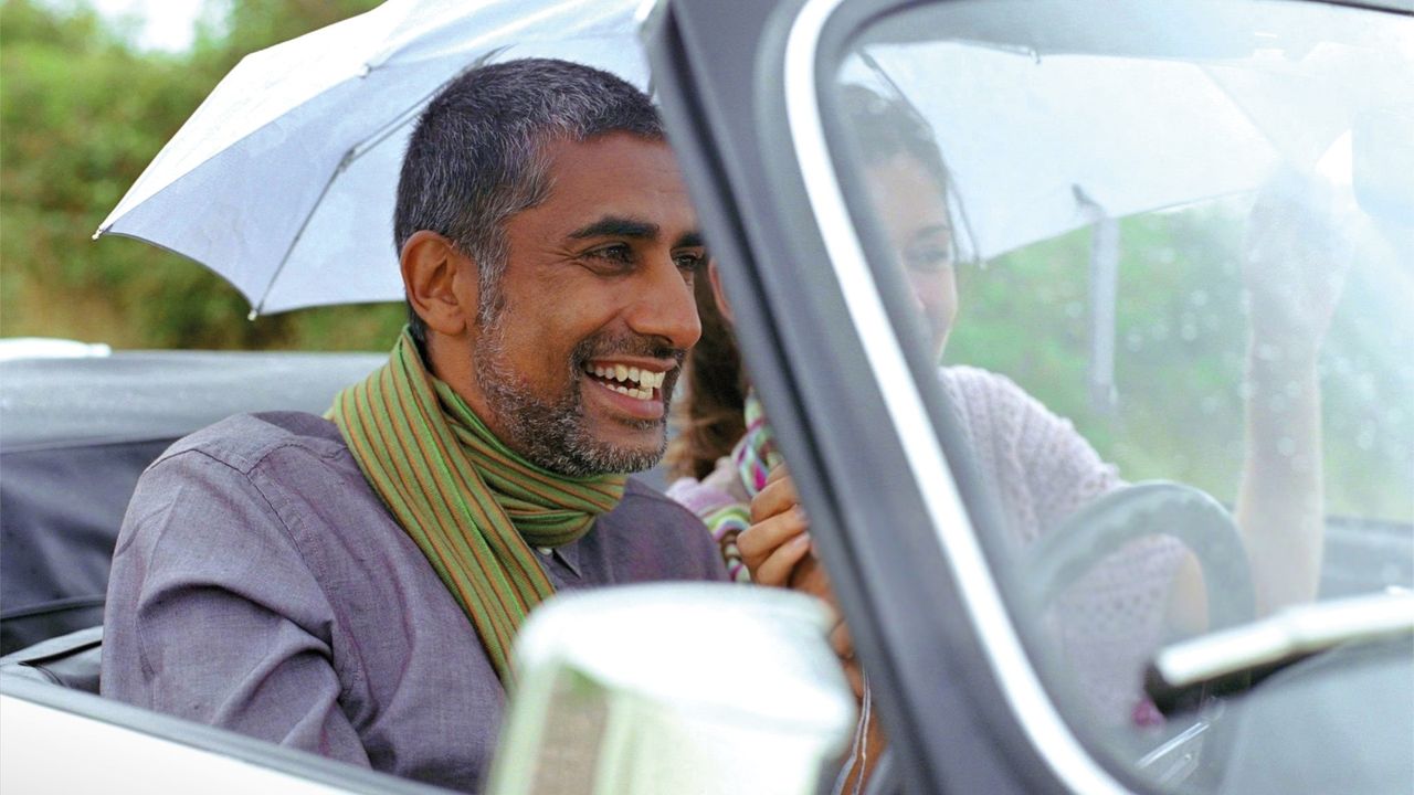 Man smiling and driving