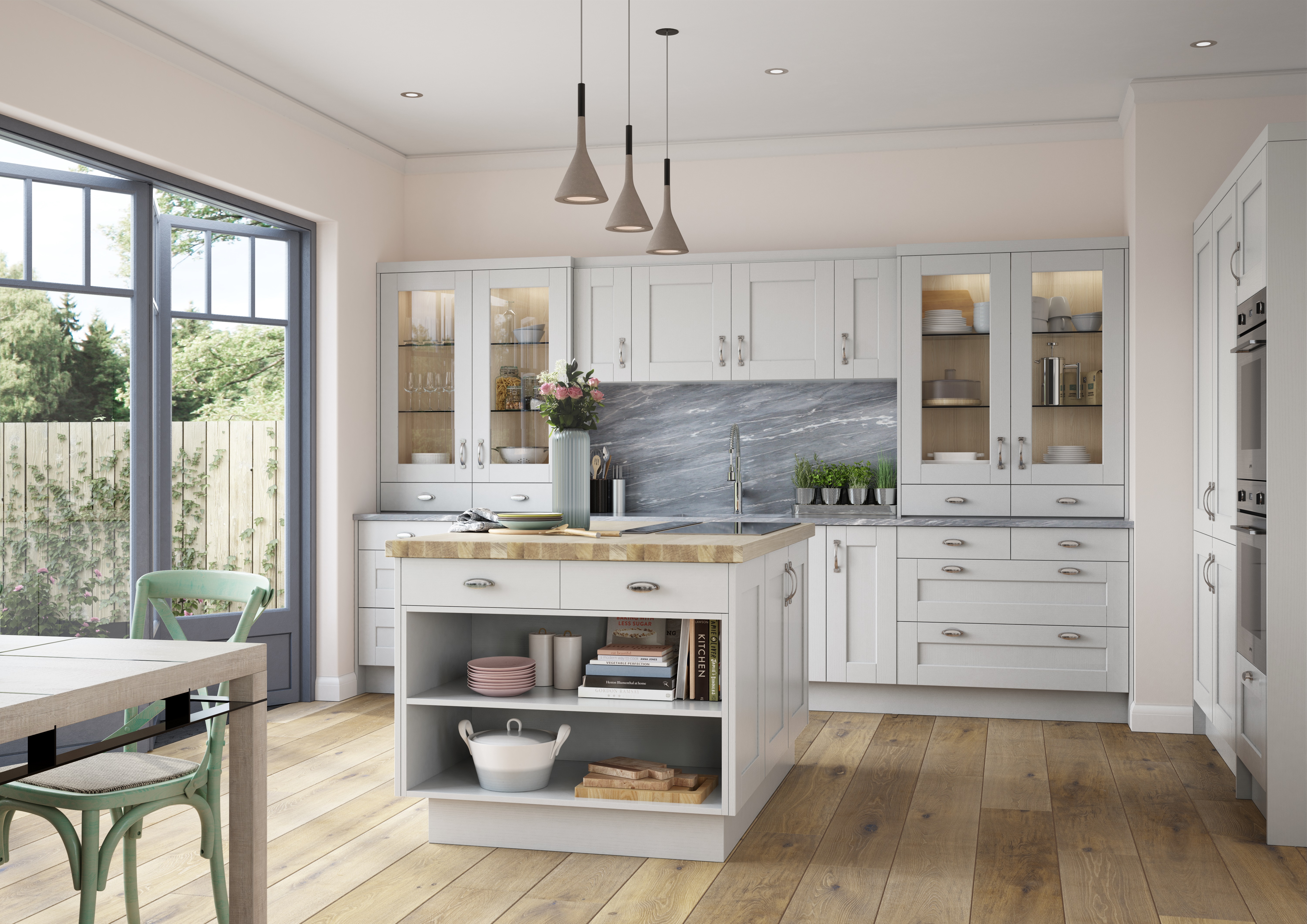 a cream kitchen with lighting in cabinets and over butcher's block island