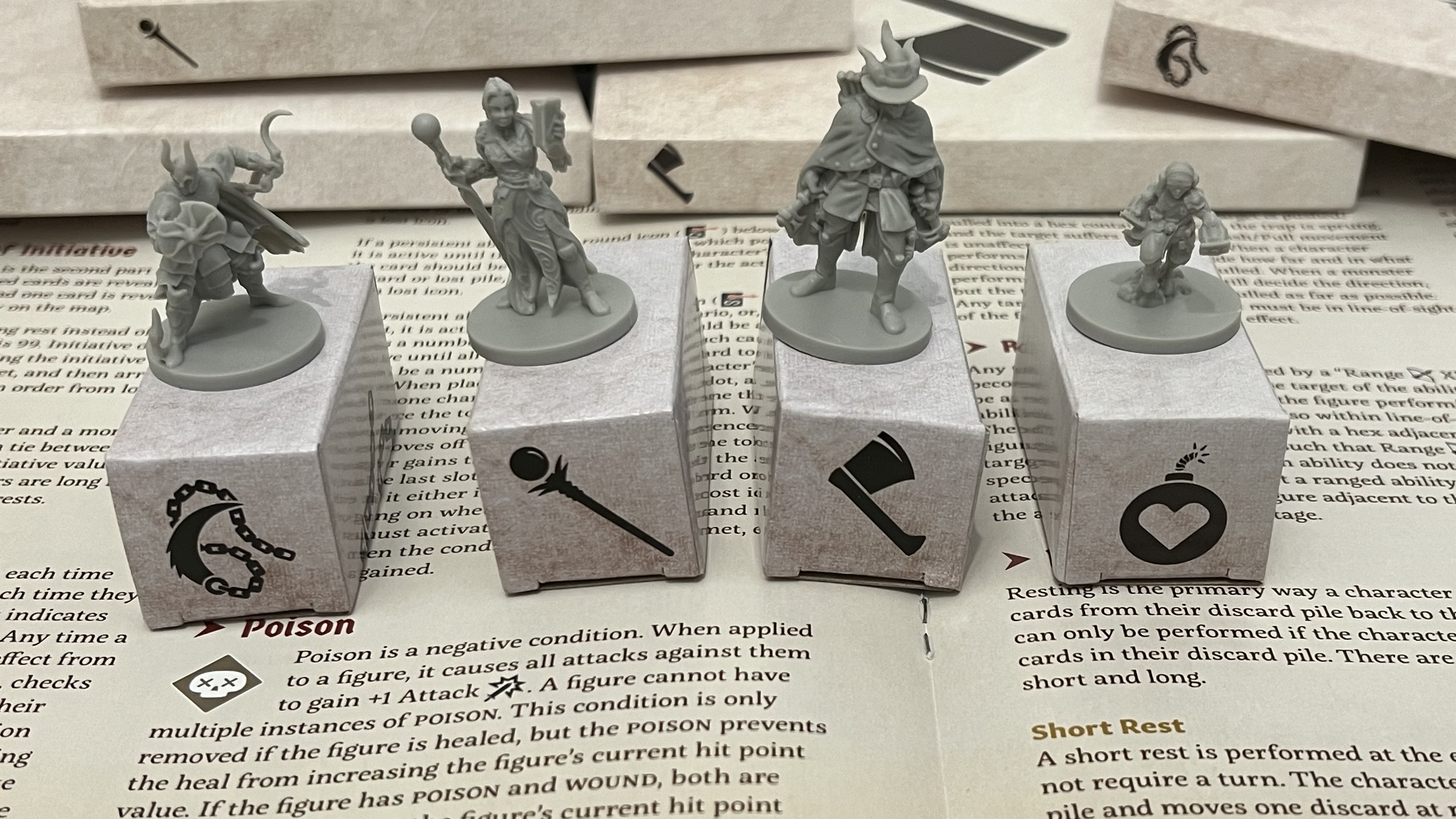 Gloomhaven: Jaws of the Lion minis showing the four classes